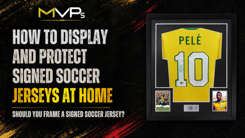 Framed signed soccer jerseys displayed and protected inside a home memorabilia collection.